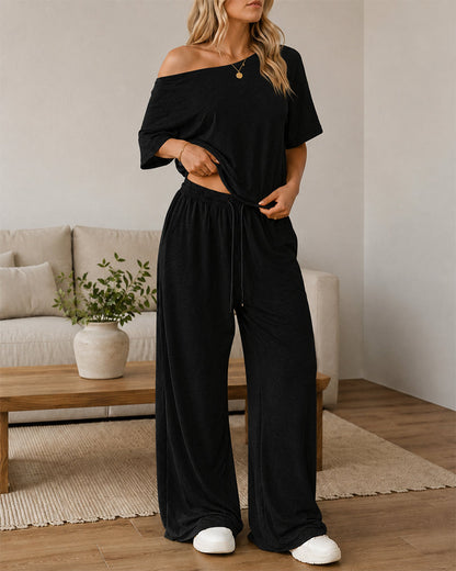Conjunto casual de top con hombros descubiertos y pantalón acampanado